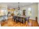 Farmhouse-style dining room with large wooden table and hardwood floors at 4946 Halifax Dr, Port Orange, FL 32127