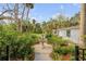 Relaxing garden oasis featuring a stone fountain and lush tropical plants at 4946 Halifax Dr, Port Orange, FL 32127