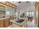 Updated kitchen with granite island, stainless steel appliances, and water views at 4946 Halifax Dr, Port Orange, FL 32127