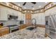 Spacious kitchen with granite countertops, stainless steel appliances, and custom cabinetry at 4946 Halifax Dr, Port Orange, FL 32127