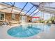 Stunning freeform pool with spa and screened patio at 4946 Halifax Dr, Port Orange, FL 32127