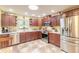 Modern kitchen featuring dark wood cabinetry, stainless steel appliances, and ample counter space at 5583 Miles Dr, Port Orange, FL 32127