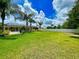 Large backyard with a screened pool and plenty of green space at 6812 Stoneheath Ln, Port Orange, FL 32128