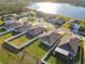 Aerial view of homes and lake in a new community at 815 Sky Haven Way, New Smyrna Beach, FL 32168