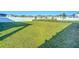 Large grassy backyard with a white vinyl fence at 815 Sky Haven Way, New Smyrna Beach, FL 32168