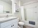 Bathroom with shower/tub, vanity, and white cabinets at 815 Sky Haven Way, New Smyrna Beach, FL 32168