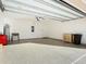 Spacious garage with epoxy flooring and built-in storage at 815 Sky Haven Way, New Smyrna Beach, FL 32168