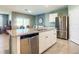 Modern kitchen featuring stainless steel appliances and granite countertops at 815 Sky Haven Way, New Smyrna Beach, FL 32168