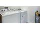 Bright laundry room with Whirlpool washer and dryer at 815 Sky Haven Way, New Smyrna Beach, FL 32168
