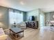 Open concept living room with a view of the dining area at 815 Sky Haven Way, New Smyrna Beach, FL 32168