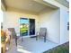 Relaxing covered patio with seating area, perfect for outdoor enjoyment at 815 Sky Haven Way, New Smyrna Beach, FL 32168