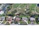 Aerial view showcasing the property's location near the golf course, with a screened-in pool at 839 Fairway Dr, New Smyrna Beach, FL 32168