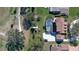 An aerial view of the pool and back of the house at 839 Fairway Dr, New Smyrna Beach, FL 32168