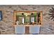 Close-up view of the bar area with a granite countertop and a pass-through to the kitchen at 839 Fairway Dr, New Smyrna Beach, FL 32168
