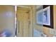 Bathroom with tiled shower and glass shower door at 839 Fairway Dr, New Smyrna Beach, FL 32168