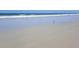 Scenic beach view with gentle waves and soft sand at 839 Fairway Dr, New Smyrna Beach, FL 32168