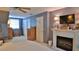 Cozy bedroom with fireplace, TV, and ample storage at 839 Fairway Dr, New Smyrna Beach, FL 32168