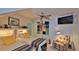 Bright and cheerful twin bedroom with colorful storage and a ceiling fan at 839 Fairway Dr, New Smyrna Beach, FL 32168