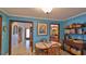 Breakfast nook with table and chairs, adjacent to the kitchen and entryway at 839 Fairway Dr, New Smyrna Beach, FL 32168