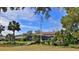 Home with dock and enclosed pool area nestled in a serene backyard at 839 Fairway Dr, New Smyrna Beach, FL 32168