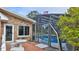 Exterior of home with brick facade and screened-in pool at 839 Fairway Dr, New Smyrna Beach, FL 32168