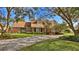 Charming two-story home with landscaped yard and large driveway at 839 Fairway Dr, New Smyrna Beach, FL 32168