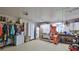 Organized garage with storage cabinets, workbench, and refrigerator at 839 Fairway Dr, New Smyrna Beach, FL 32168