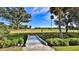 Small bridge leading to a serene golf course with lush greenery at 839 Fairway Dr, New Smyrna Beach, FL 32168