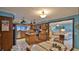 Kitchen with island, stainless steel appliances, and breakfast nook at 839 Fairway Dr, New Smyrna Beach, FL 32168
