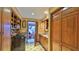 Laundry room with wooden cabinets, washer, dryer, and access to a sunroom at 839 Fairway Dr, New Smyrna Beach, FL 32168