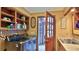 Laundry room with ample storage, washer, dryer, and access to a sunroom at 839 Fairway Dr, New Smyrna Beach, FL 32168