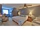 Serene main bedroom with a king-size bed, cozy seating area, and stylish decor at 839 Fairway Dr, New Smyrna Beach, FL 32168