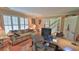 Cozy home office with plantation shutters and comfortable seating at 839 Fairway Dr, New Smyrna Beach, FL 32168