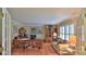 Bright home office with wood floors and ample seating at 839 Fairway Dr, New Smyrna Beach, FL 32168