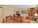 Home office with wood floors, built-in shelves, and ample natural light at 839 Fairway Dr, New Smyrna Beach, FL 32168