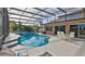 Enjoy Florida living with this screened pool, spa, and outdoor furniture at 839 Fairway Dr, New Smyrna Beach, FL 32168
