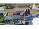 Screened-in pool and lanai with a view of the golf course at 839 Fairway Dr, New Smyrna Beach, FL 32168