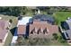 View of the roof, pool, and driveway from above at 839 Fairway Dr, New Smyrna Beach, FL 32168