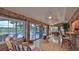 Bright sunroom with pool views, bar seating, and tiled floors at 839 Fairway Dr, New Smyrna Beach, FL 32168