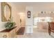 Elegant entryway with decorative console table and mirror at 1064 Chelsea Way, Port Orange, FL 32129