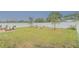 Large backyard with grassy lawn and white fence at 1911 Hollybrooke Rd, Edgewater, FL 32141