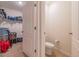 Small bathroom with toilet and storage closet at 1911 Hollybrooke Rd, Edgewater, FL 32141