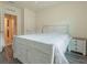 Bedroom with a white wooden bed frame and nightstand at 1911 Hollybrooke Rd, Edgewater, FL 32141