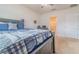 Main bedroom with a large bed and en-suite bathroom at 1911 Hollybrooke Rd, Edgewater, FL 32141