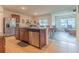 Open kitchen features an island and stainless steel appliances at 1911 Hollybrooke Rd, Edgewater, FL 32141