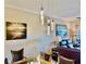 Elegant dining room featuring a modern chandelier and coastal art at 261 Minorca Beach Way # 204, New Smyrna Beach, FL 32169