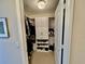 Large walk-in closet with custom shelving and ample storage at 261 Minorca Beach Way # 204, New Smyrna Beach, FL 32169