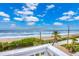 Ocean view from deck, showing beach and partial roadside view at 6368 S Atlantic Ave, New Smyrna Beach, FL 32169