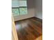 Bedroom with wood-look floors and window with blinds at 827 Camargo Way # 307, Altamonte Springs, FL 32714