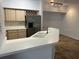 Kitchen features a breakfast bar and tile flooring at 827 Camargo Way # 307, Altamonte Springs, FL 32714